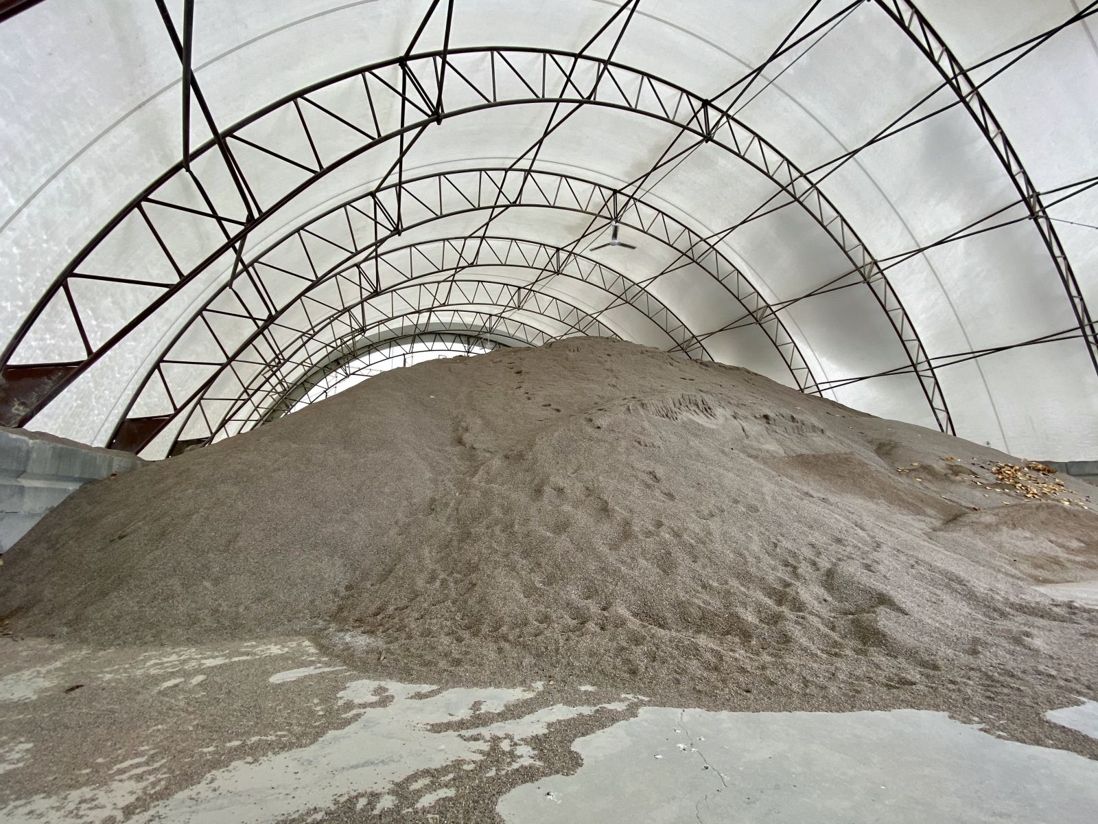 Tiny pebbles of gravel piled high inside a heated facility