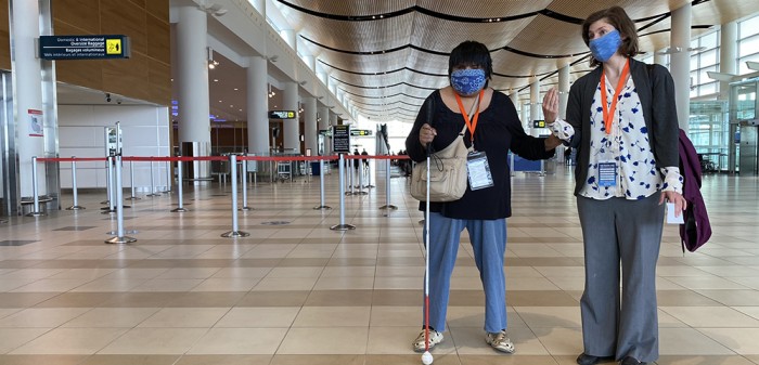 An individual participating in the passenger rehearsal program on the Departures Level